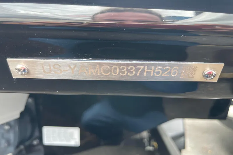 Slide: The Image of 2026 Yamaha AR250 identification plate with serial number, mounted on a black surface. - 4