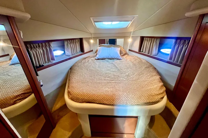 Slide: The Image of Luxurious cabin interior of 2007 Sea Ray 38 Sundancer yacht with cozy bedding. - 13