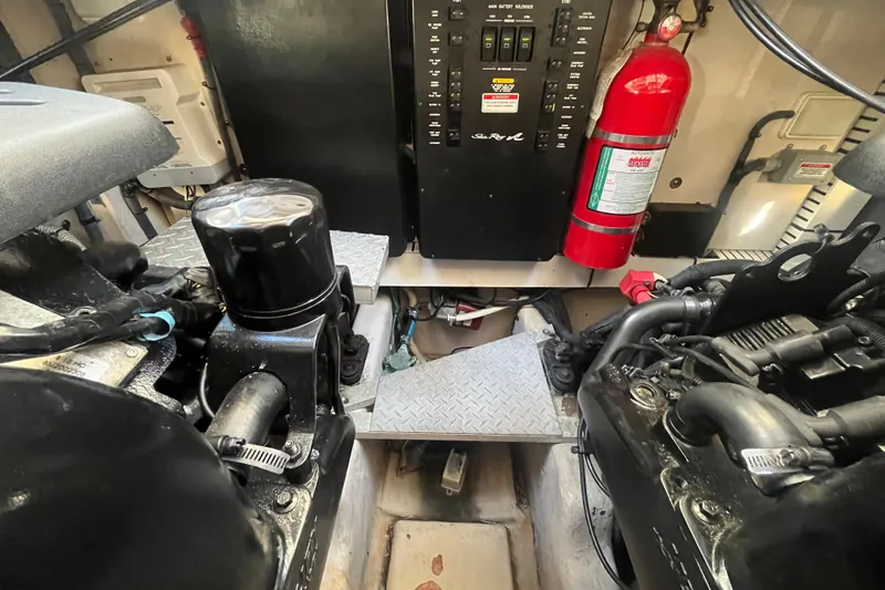 Slide: The Image of Engine room of 2007 Sea Ray 38 Sundancer with fire extinguisher and control panel. - 20