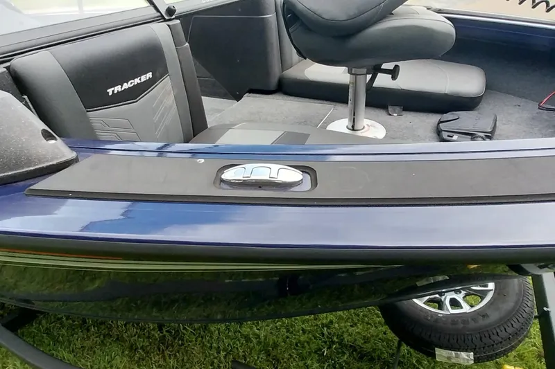 Slide: The Image of 2024 Tracker Targa V-18 Combo boat interior with seating and storage features. - 19