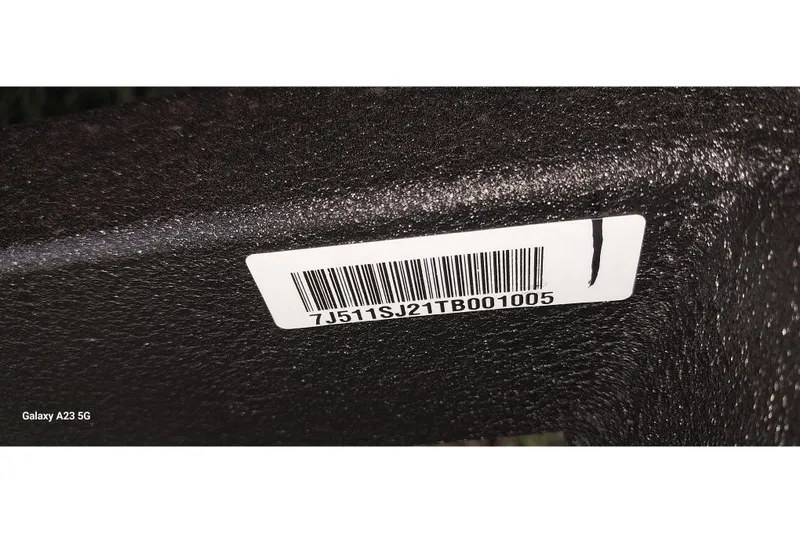 Slide: The Image of Barcode sticker on 2024 Tracker Targa V-18 Combo boat surface. - 2