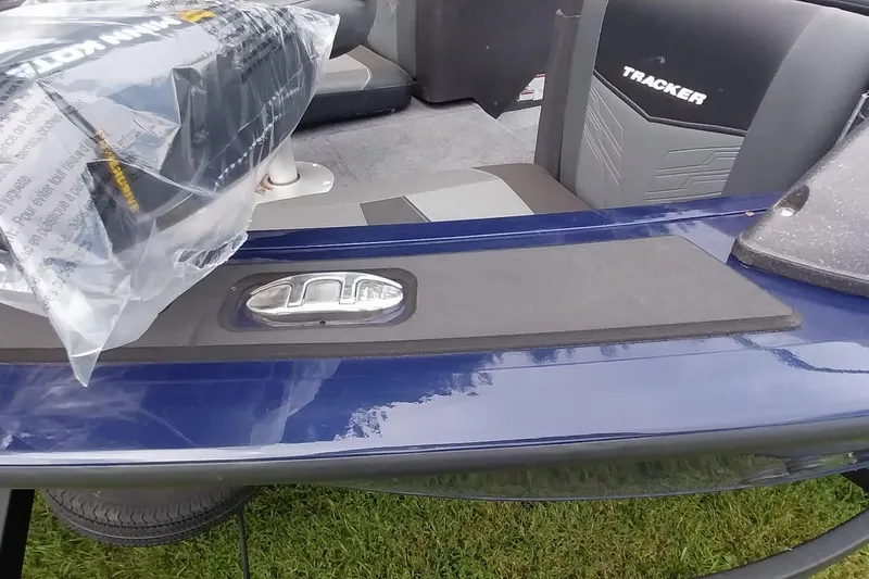 Slide: The Image of 2024 Tracker Targa V-18 Combo boat interior with seating and chrome details. - 29