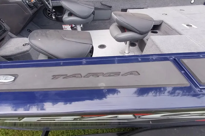 Slide: The Image of 2024 Tracker Targa V-18 Combo boat interior with seating and dashboard view. - 36