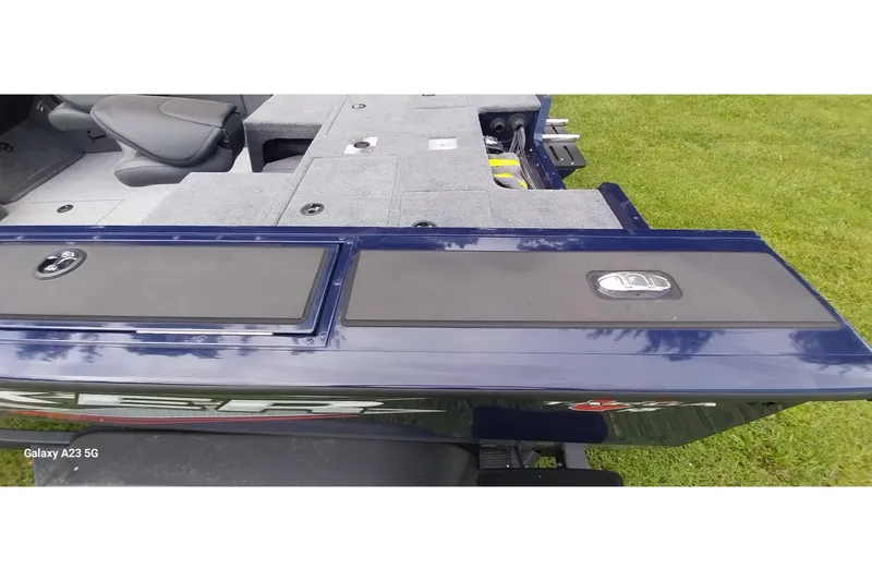 Slide: The Image of 2024 Tracker Targa V-18 Combo boat interior with seating and storage compartments. - 42