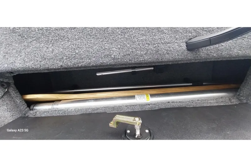 Slide: The Image of 2024 Tracker Targa V-18 Combo storage compartment with fishing rod holder. - 45