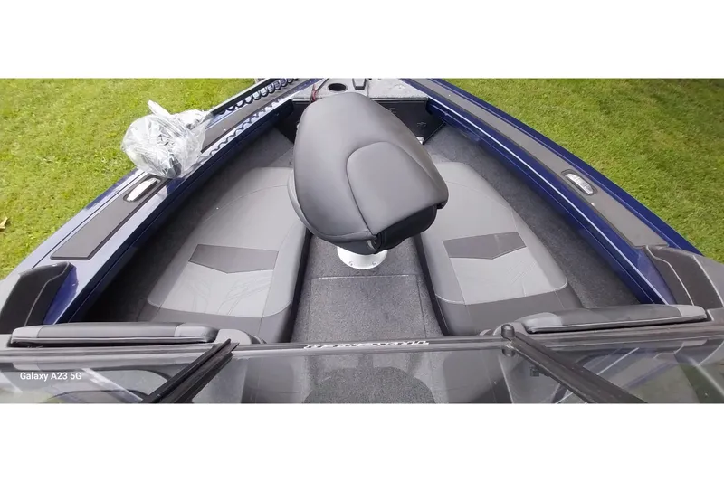 Slide: The Image of 2024 Tracker Targa V-18 Combo boat interior with seating and steering. - 48