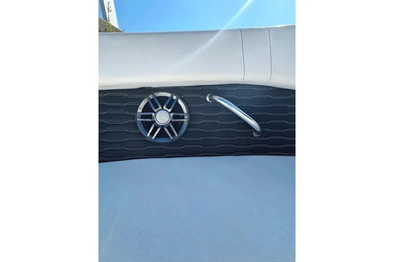 Slide: The Image of 2022 Sea Ray SPX 230 Outboard interior detail with speaker and handle. - 14