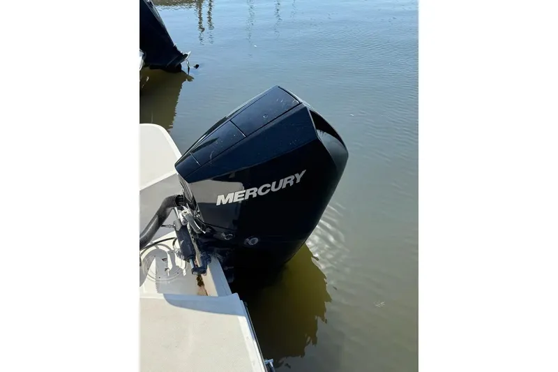 Slide: The Image of 2022 Sea Ray SPX 230 Outboard with Mercury engine on calm water. - 21
