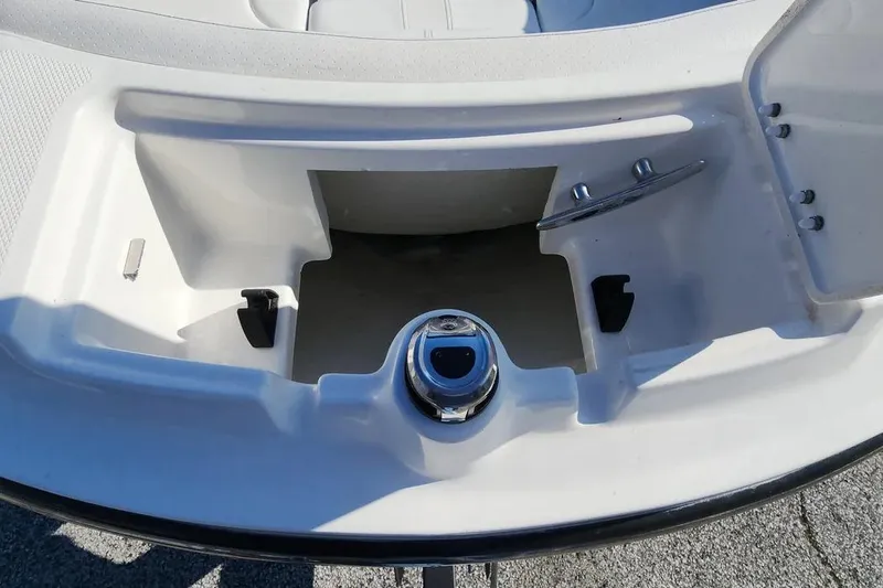 Slide: The Image of 2022 Sea Ray SPX 230 Outboard boat storage compartment with chrome fittings. - 22