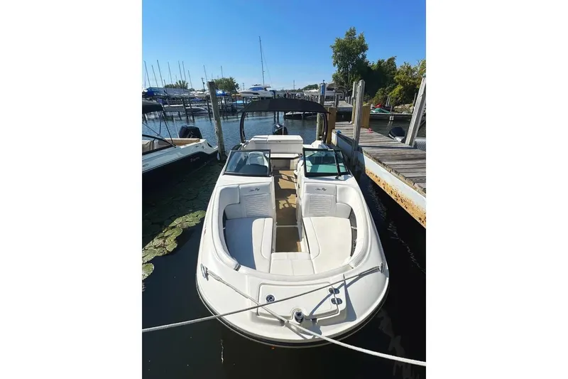 Slide: The Image of 2022 Sea Ray SPX 230 Outboard boat docked at marina, sunny day. - 32