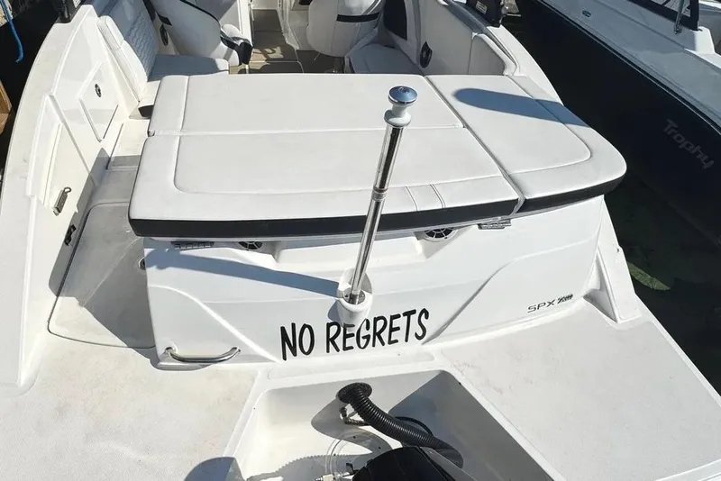 Slide: The Image of 2022 Sea Ray SPX 230 Outboard boat with "No Regrets" text on the stern. - 38