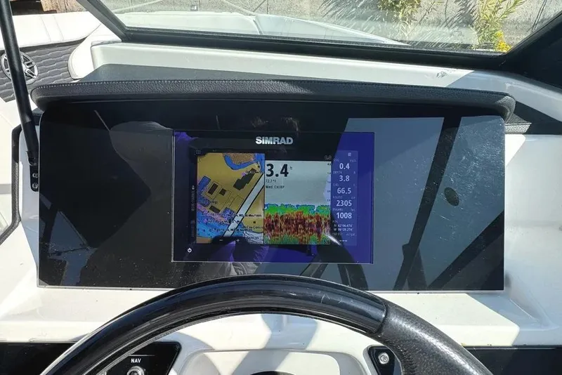 Slide: The Image of Simrad navigation display on 2022 Sea Ray SPX 230 Outboard boat dashboard. - 4