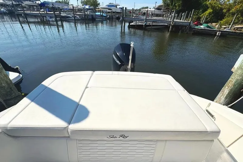 Slide: The Image of 2022 Sea Ray SPX 230 Outboard boat at a marina dock. - 48
