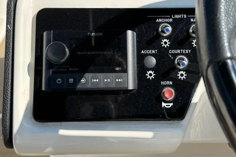 Slide: The Image of Control panel of 2022 Sea Ray SPX 230 Outboard with audio and light switches. - 5