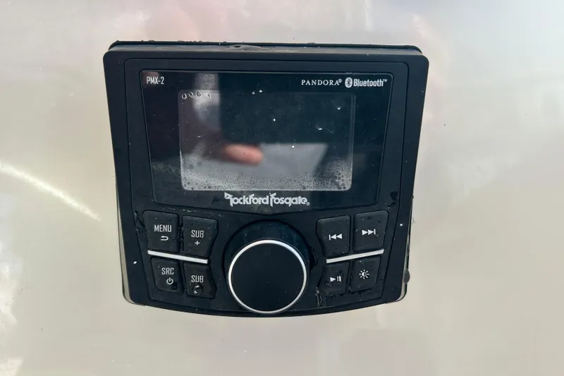 Slide: The Image of Rockford Fosgate PMX-2 stereo system on 2000 Pursuit 2470 Walkaround boat, featuring Bluetooth and Pandora. - 15
