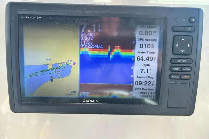 Slide: The Image of Garmin GPS display on 2000 Pursuit 2470 Walkaround, showing navigation and sonar data. - 16