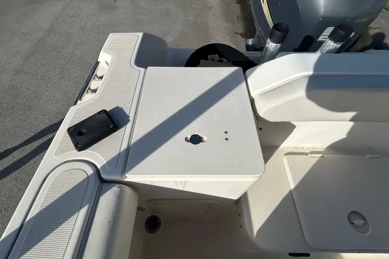 Slide: The Image of 2000 Pursuit 2470 Walkaround boat interior with seating and storage compartments. - 9