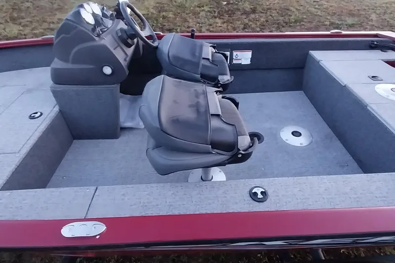 Slide: The Image of 2021 Tracker Super Guide V-16 SC boat interior with dual seats and steering console. - 18