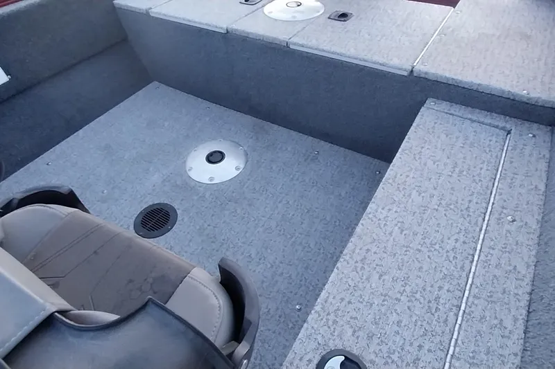 Slide: The Image of 2021 Tracker Super Guide V-16 SC boat interior with seating and storage compartments. - 19