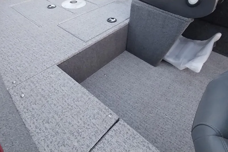 Slide: The Image of 2021 Tracker Super Guide V-16 SC boat interior with storage compartment. - 20