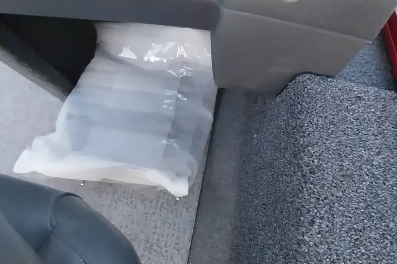 Slide: The Image of 2021 Tracker Super Guide V-16 SC interior with protective packaging visible. - 21