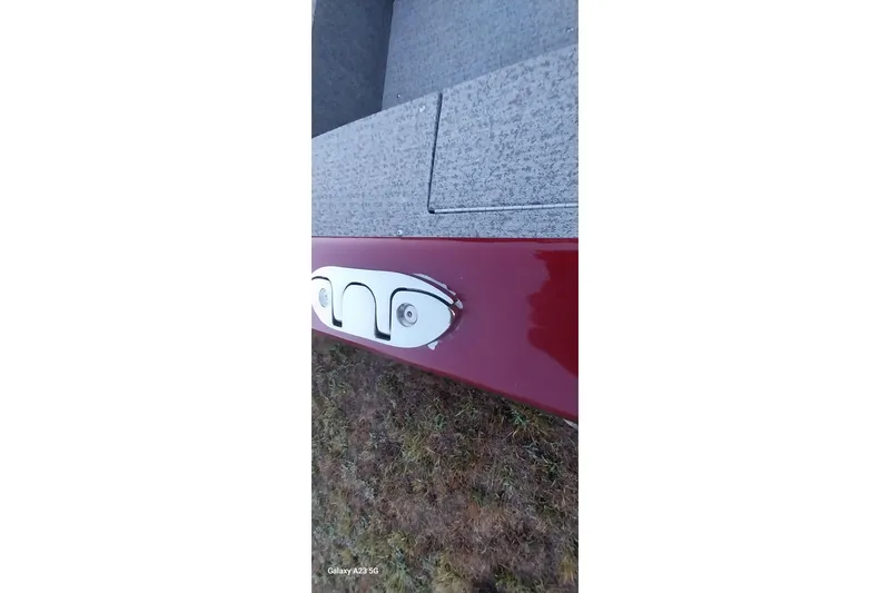 Slide: The Image of 2021 Tracker Super Guide V-16 SC boat detail, red exterior with gray interior. - 23