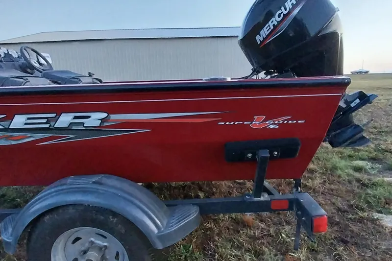 Slide: The Image of 2021 Tracker Super Guide V-16 SC boat with Mercury outboard motor on trailer. - 24