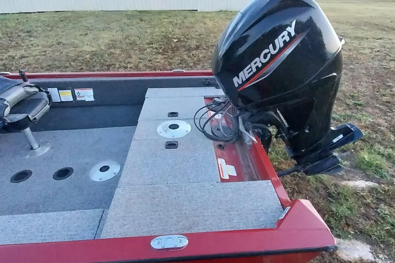 Slide: The Image of 2021 Tracker Super Guide V-16 SC boat with Mercury outboard motor, red and gray interior. - 27