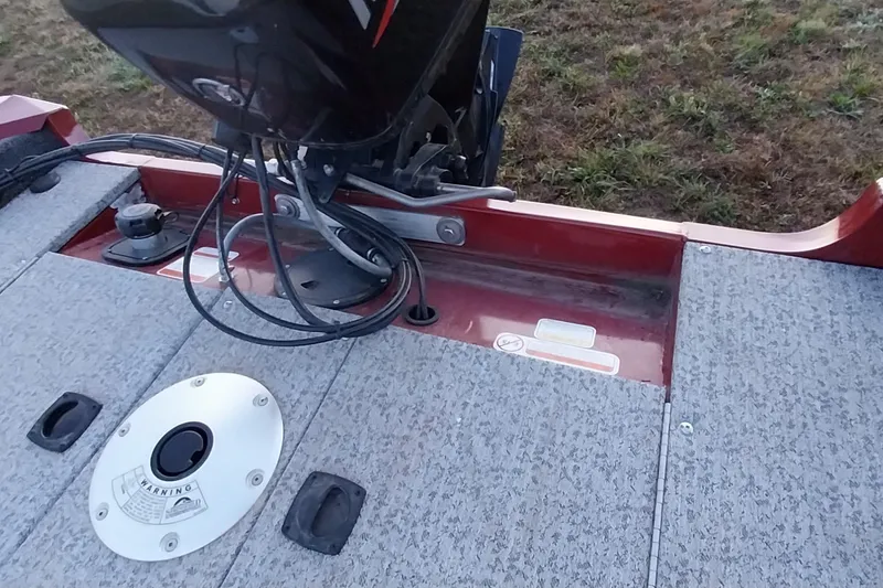 Slide: The Image of 2021 Tracker Super Guide V-16 SC boat deck with motor and warning label. - 28