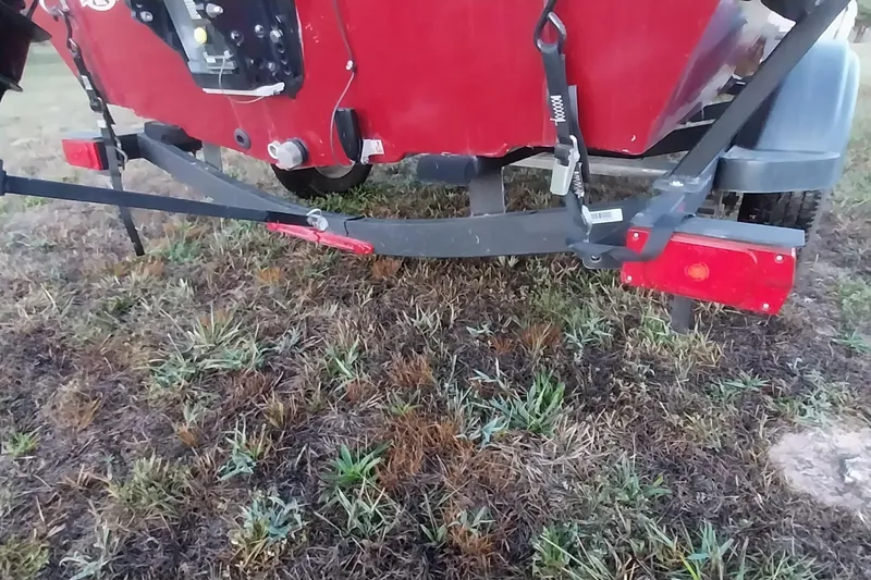 Slide: The Image of Rear view of a 2021 Tracker Super Guide V-16 SC boat on a trailer. - 33