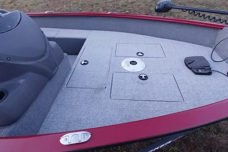 Slide: The Image of 2021 Tracker Super Guide V-16 SC boat deck with storage compartments and trolling motor. - 4