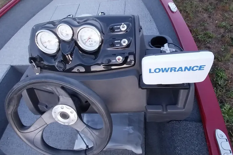 Slide: The Image of 2021 Tracker Super Guide V-16 SC dashboard with Lowrance fishfinder and steering wheel. - 49
