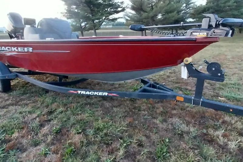 Slide: The Image of 2021 Tracker Super Guide V-16 SC boat on trailer, parked on grass. - 6