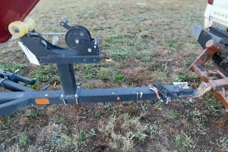 Slide: The Image of Trailer hitch of 2021 Tracker Super Guide V-16 SC on grassy field. - 7