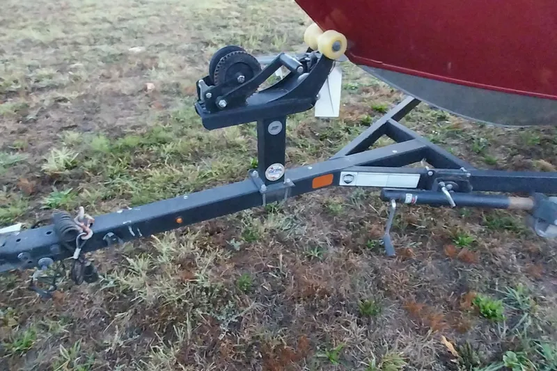 Slide: The Image of Trailer hitch of 2021 Tracker Super Guide V-16 SC on grassy ground. - 8