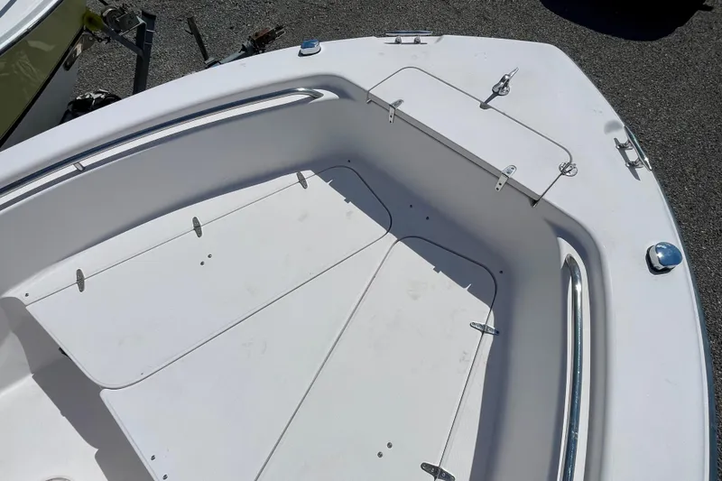 Slide: The Image of 2004 Grady-White Advance 257 boat deck with storage compartments and stainless steel railings. - 10