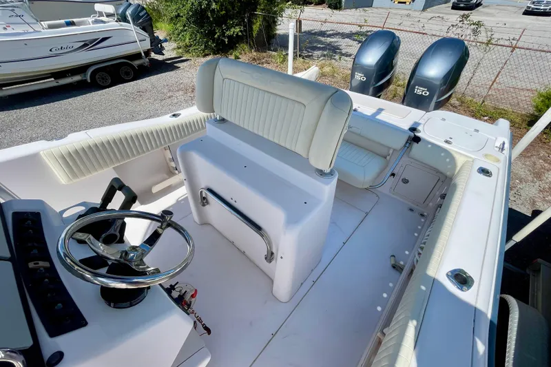 Slide: The Image of 2004 Grady-White Advance 257 boat interior with dual Yamaha 150 engines. - 11