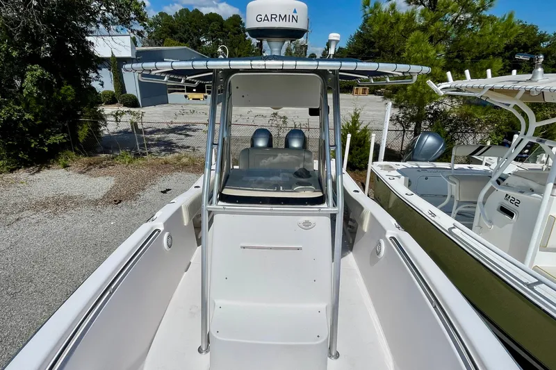 Slide: The Image of 2004 Grady-White Advance 257 boat with Garmin equipment, docked outdoors. - 13
