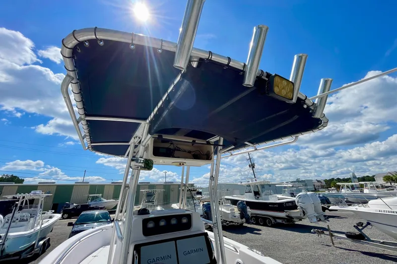 Slide: The Image of 2004 Grady-White Advance 257 boat with T-top under sunny blue sky. - 14