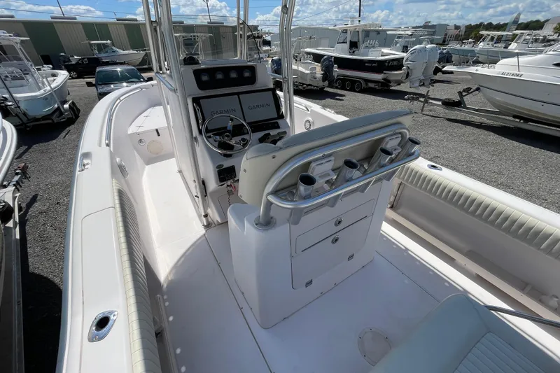 Slide: The Image of 2004 Grady-White Advance 257 boat interior with Garmin navigation, docked among other boats. - 15