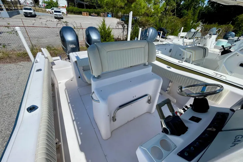 Slide: The Image of 2004 Grady-White Advance 257 boat interior with dual Yamaha 150 engines. - 19