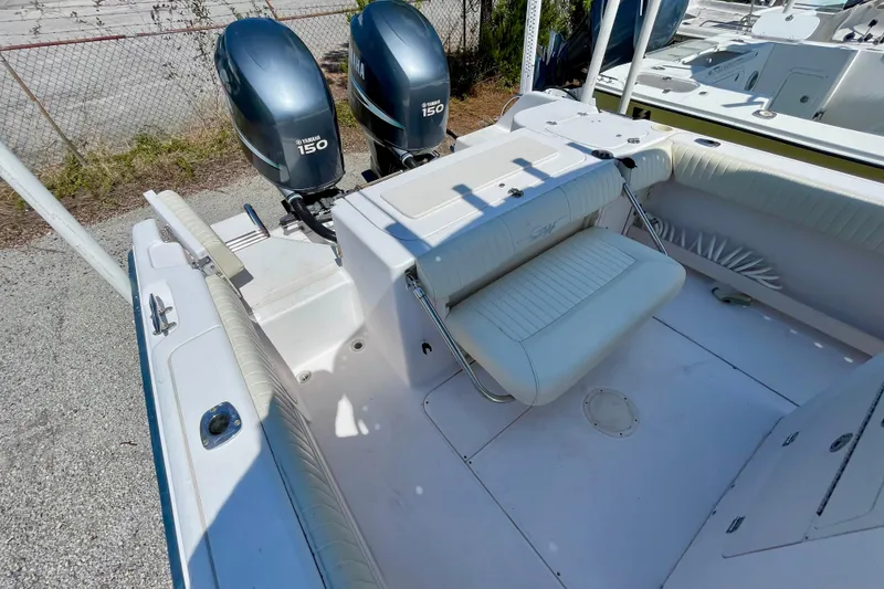 Slide: The Image of 2004 Grady-White Advance 257 boat with twin Yamaha 150 engines, white seating. - 20