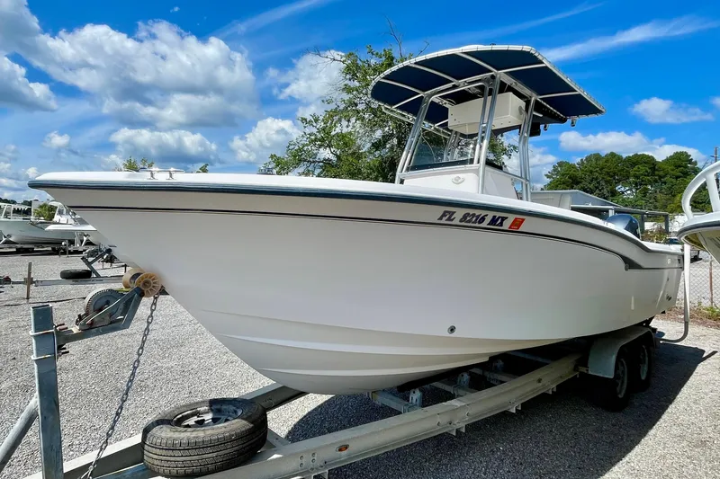 Slide: The Image of 2004 Grady-White Advance 257 boat on trailer under blue sky. - 3