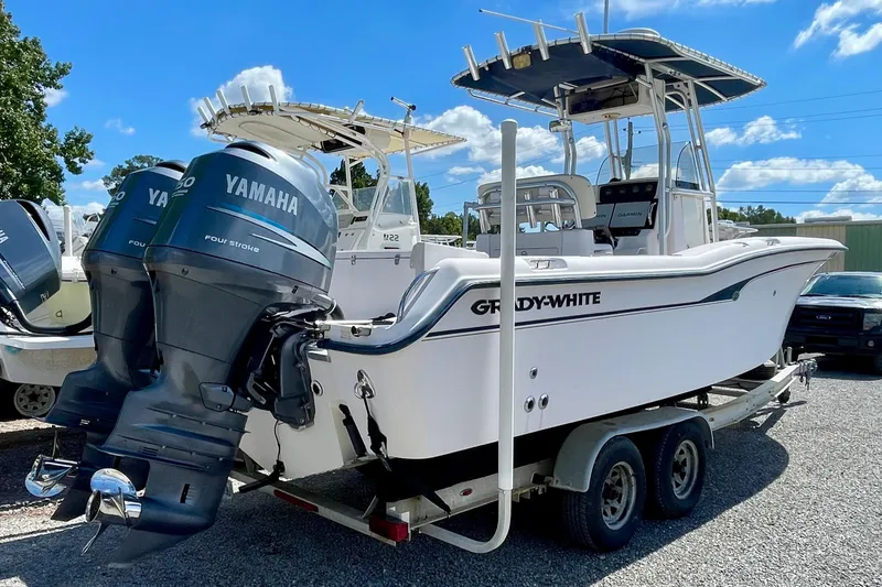 Slide: The Image of 2004 Grady-White Advance 257 boat with twin Yamaha engines on a trailer. - 4