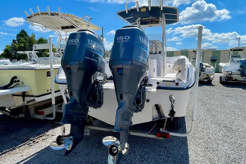 Slide: The Image of 2004 Grady-White Advance 257 boat with twin Yamaha 150 engines, parked outdoors. - 8