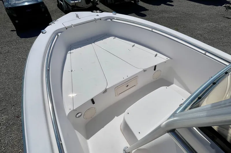 Slide: The Image of 2004 Grady-White Advance 257 boat interior, featuring spacious deck and storage compartments. - 9