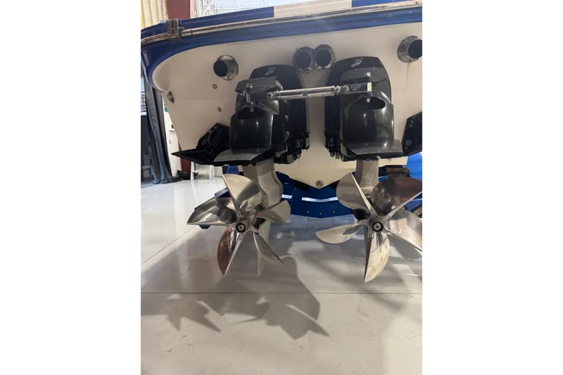 Slide: The Image of Rear view of 2016 Hustler 39 boat showing dual propellers and outboard motors. - 10