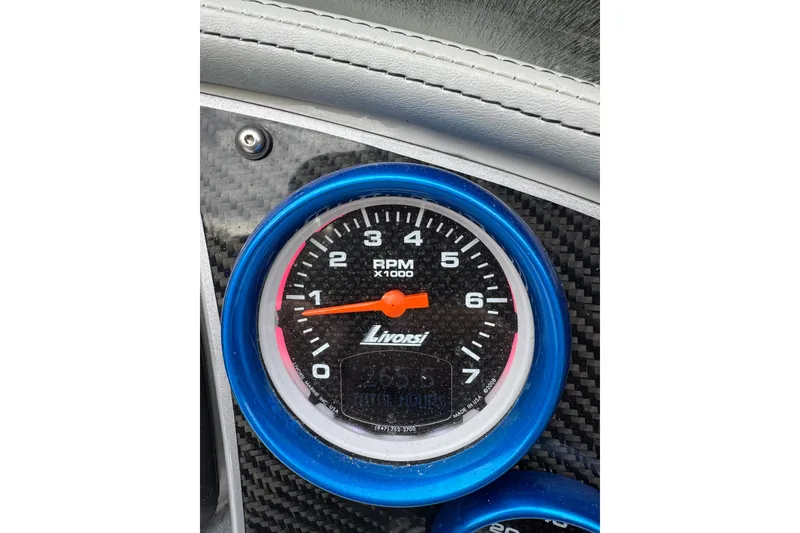 Slide: The Image of Close-up of a Livorsi RPM gauge in a 2016 Hustler 39 boat. - 24