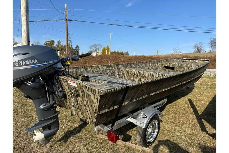 Slide: The Image of 2025 Smoker Craft 1648 Jon boat with Yamaha motor on trailer, camo design. - 4