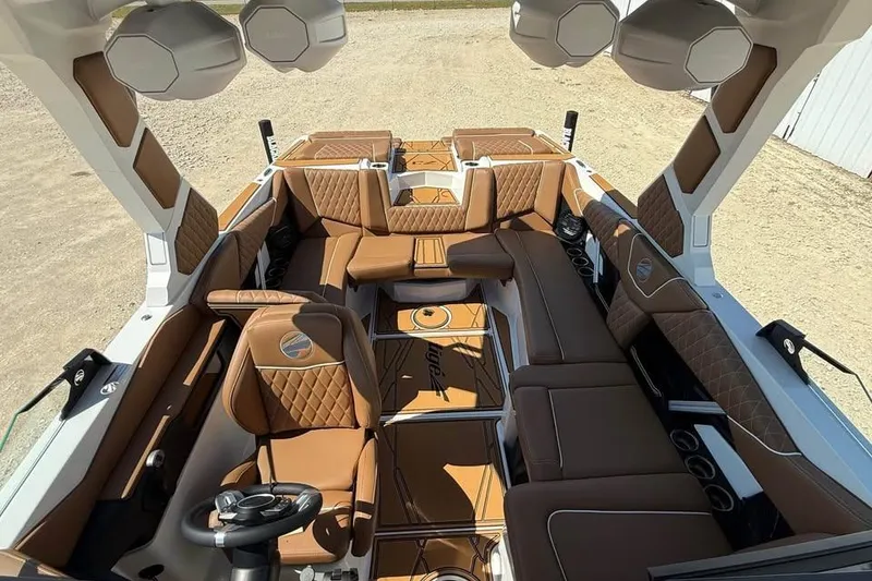 Slide: The Image of 2026 Tigé Z3 boat interior with luxurious brown leather seating and modern design. - 10
